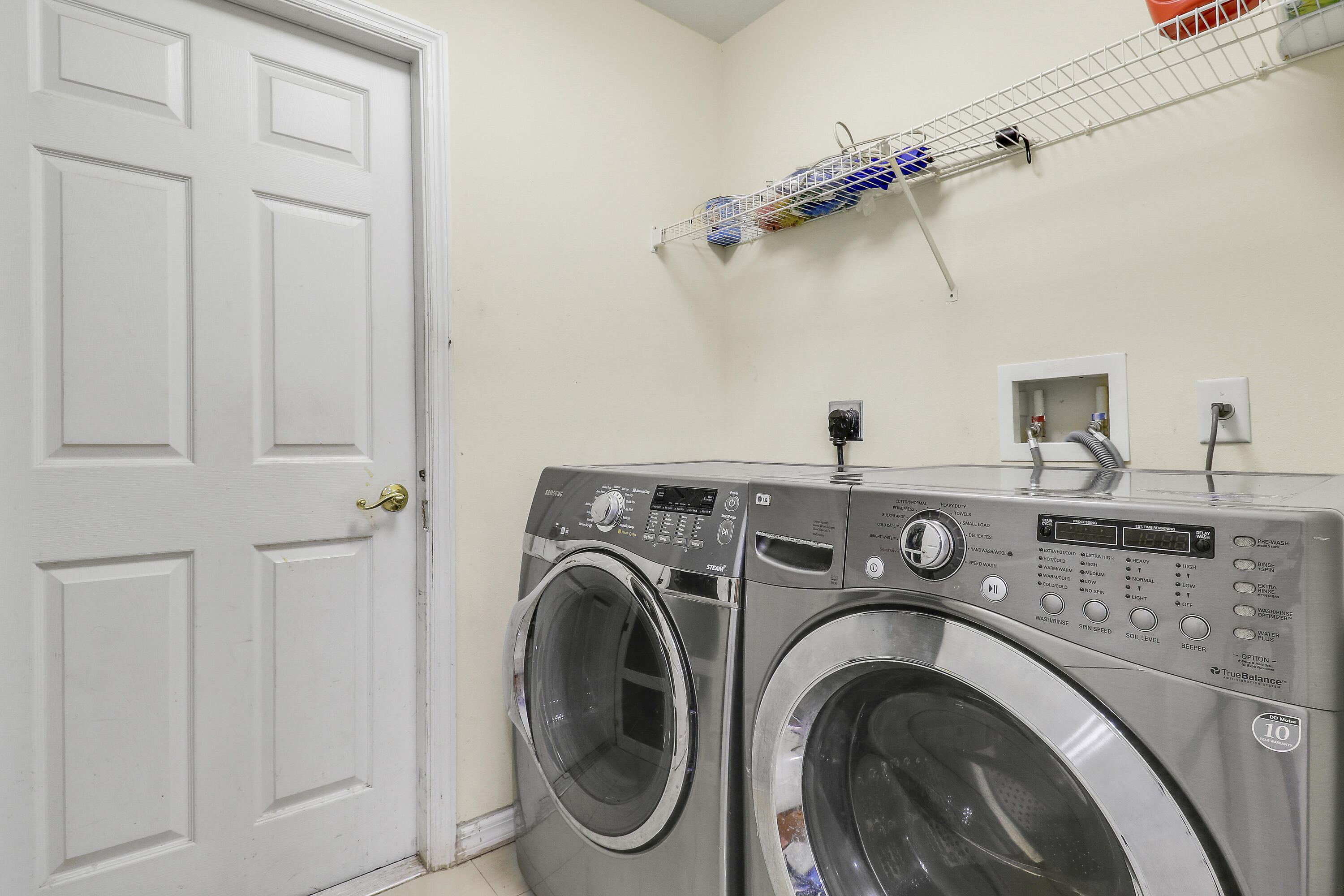 2085 Southwest Aladdin Street Port St. Lucie, FL 34953 - Photo 36 of 45 a utility room with dryer and washer