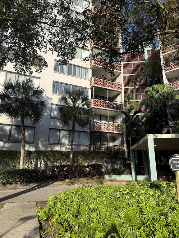 4222 Inverrary Boulevard, Unit 4609 Lauderhill, FL 33319 - Photo 2 of 29 a front view of a house with a yard