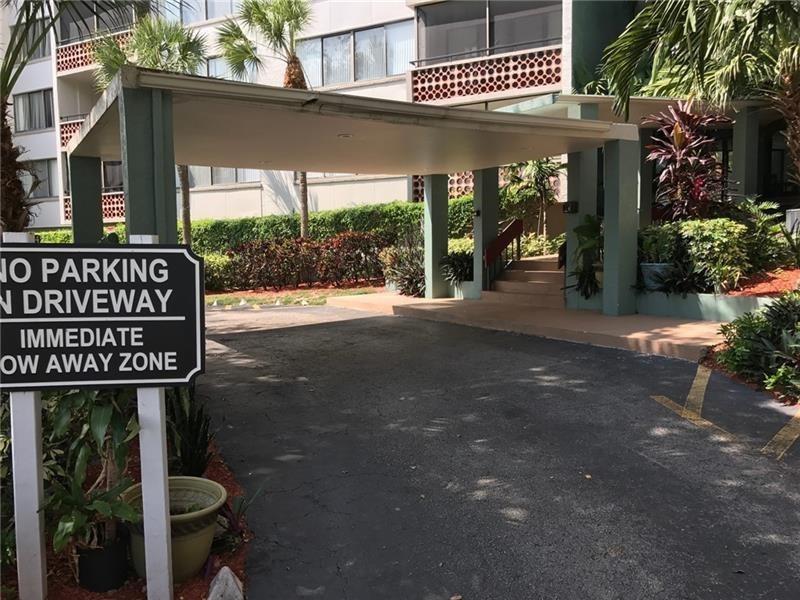 4222 Inverrary Boulevard, Unit 4609 Lauderhill, FL 33319 - Photo 3 of 29 a sign on the side of a building