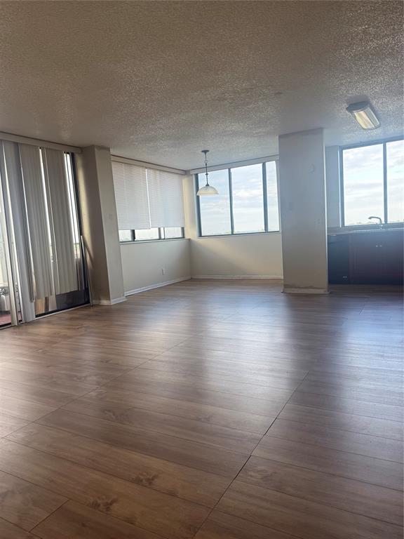 4222 Inverrary Boulevard, Unit 4609 Lauderhill, FL 33319 - Photo 7 of 29 a view of an empty room with a window and wooden floor
