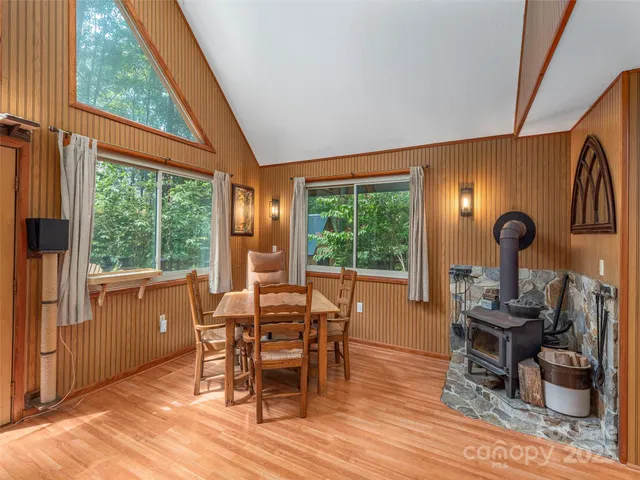a dining room with furniture water view and wooden floor