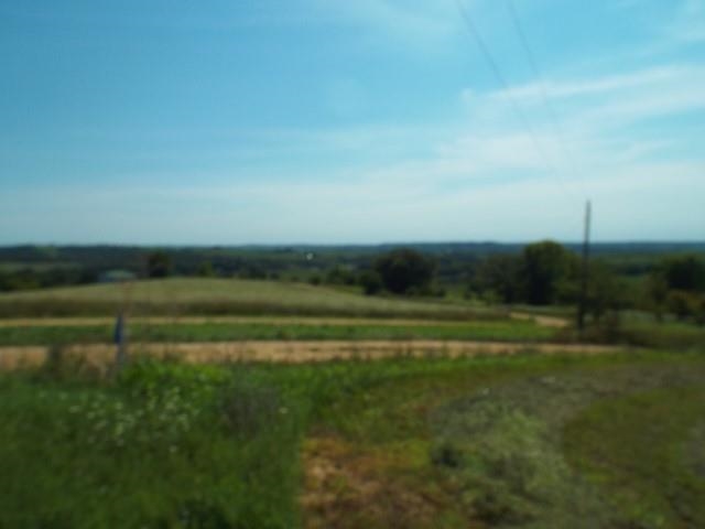 3175 West Mitchell Road Hanover, IL 61041 - Photo 7 of 23 a view of a golf course with a lake