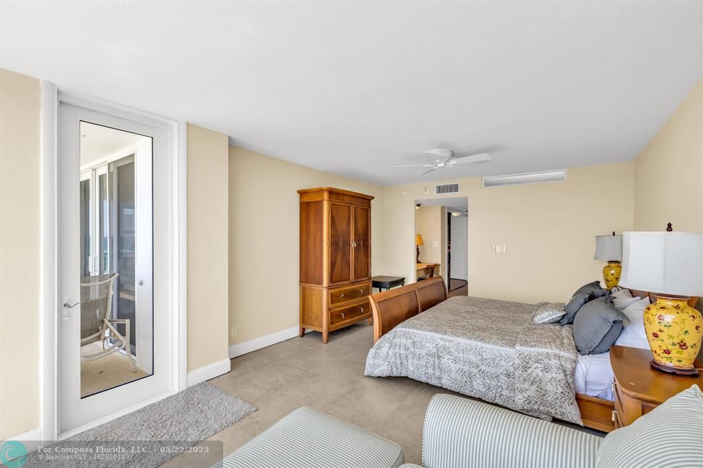 3000 South Ocean Boulevard, Unit 1106 Boca Raton, FL 33432 - Photo 11 of 30 a bedroom with a bed and wooden floor