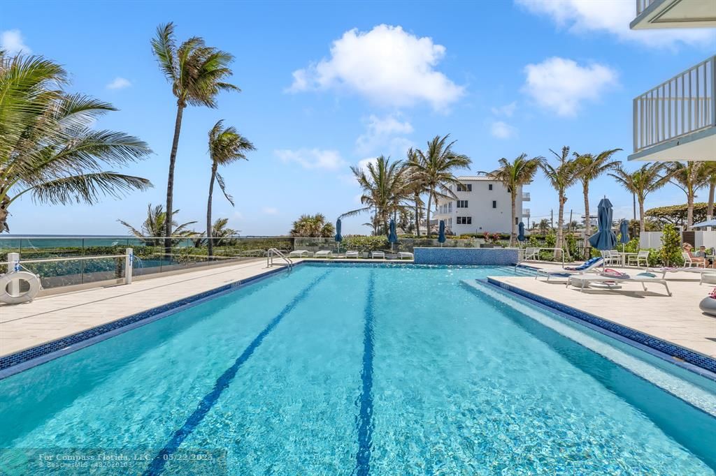 3000 South Ocean Boulevard, Unit 1106 Boca Raton, FL 33432 - Photo 21 of 30 a swimming pool with outdoor seating and yard