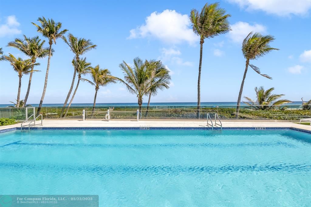 3000 South Ocean Boulevard, Unit 1106 Boca Raton, FL 33432 - Photo 22 of 30 a view of a swimming pool and a yard