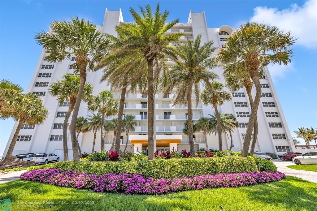 3000 South Ocean Boulevard, Unit 1106 Boca Raton, FL 33432 - Photo 29 of 30 a front view of multi story residential apartment building with yard and green space