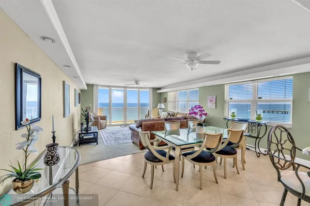 a view of a dining room with furniture and a livingroom