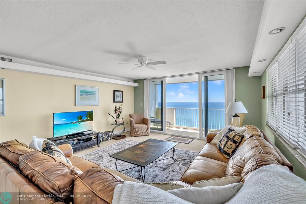 3000 South Ocean Boulevard, Unit 1106 Boca Raton, FL 33432 - Photo 6 of 30 a living room with furniture and a flat screen tv