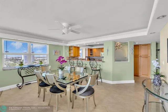 a view of a dining room with furniture and a livingroom