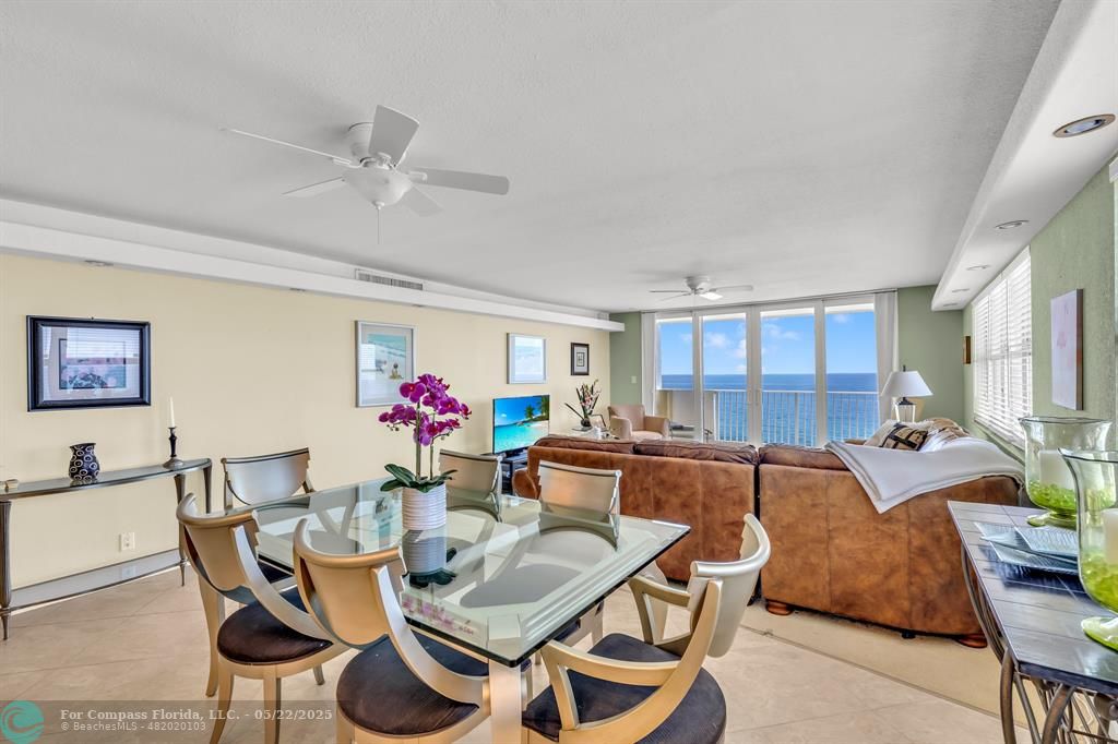 3000 South Ocean Boulevard, Unit 1106 Boca Raton, FL 33432 - Photo 10 of 30 a living room with furniture a chandelier and a dining table