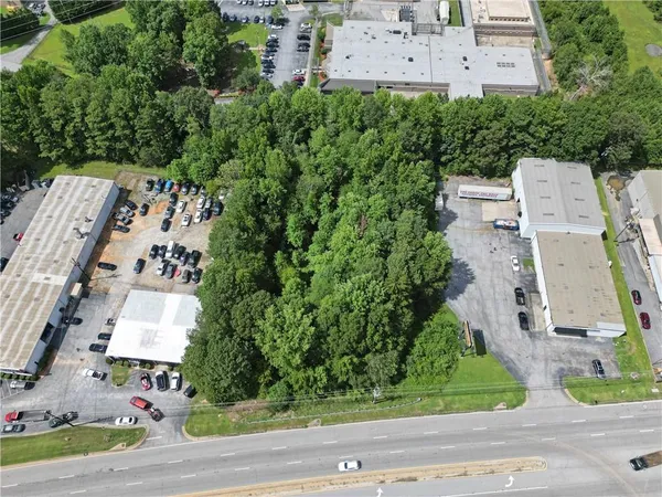 an aerial view of a house with a yard and garden space