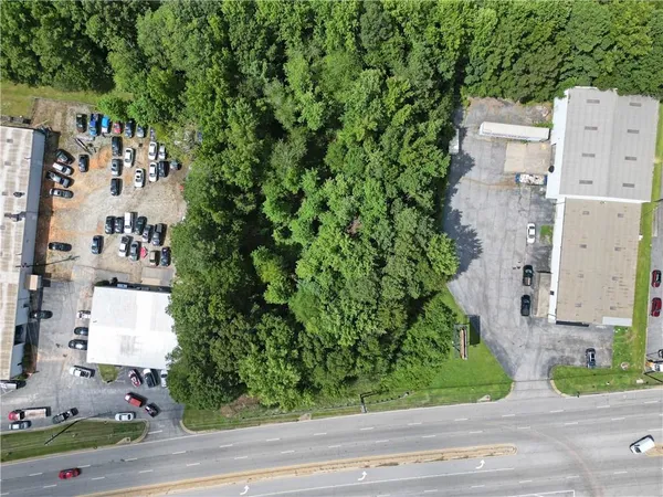 a aerial view of a house with a yard and garden