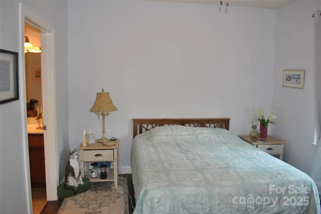 a bedroom with a bed and a table in it