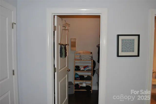 a view of a hallway with closet