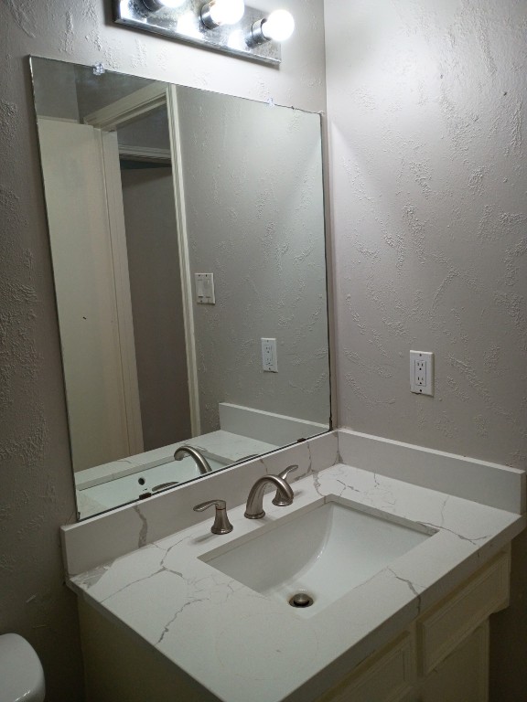 4515 Seneca Street Pasadena, TX 77504 - Photo 11 of 18 a bathroom with a sink and a mirror