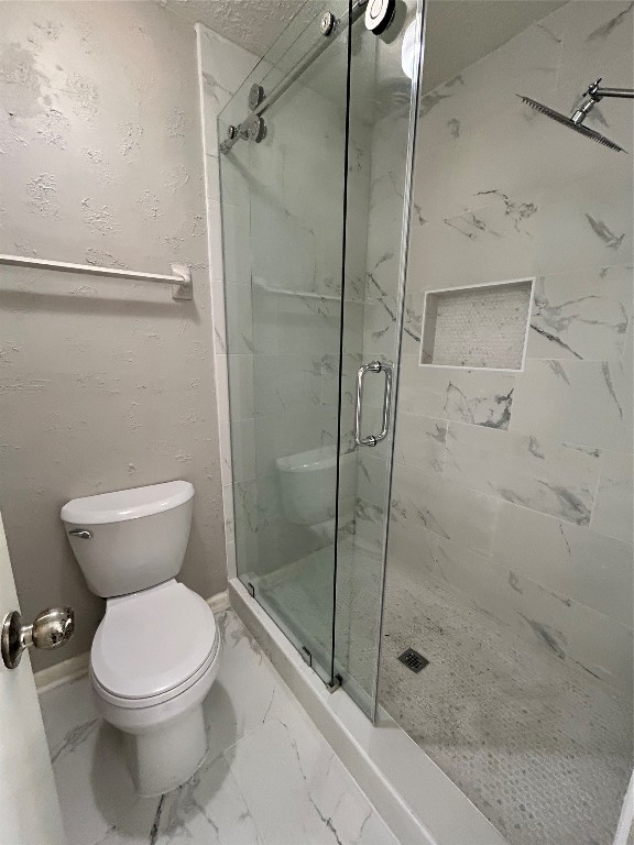 4515 Seneca Street Pasadena, TX 77504 - Photo 15 of 18 a bathroom with a toilet and a shower