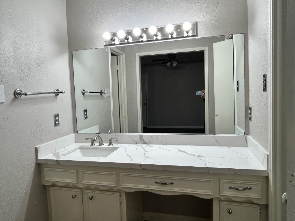 4515 Seneca Street Pasadena, TX 77504 - Photo 16 of 18 a bathroom with a sink and a mirror