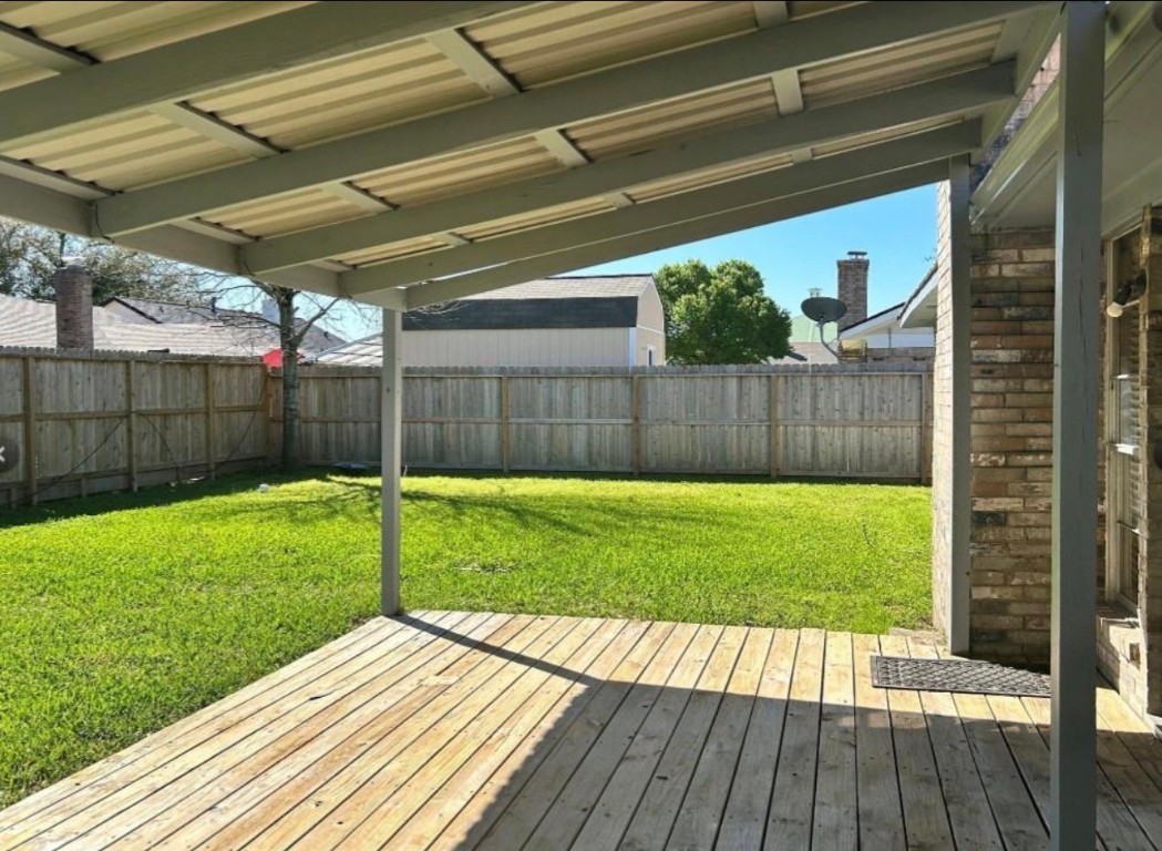4515 Seneca Street Pasadena, TX 77504 - Photo 17 of 18 a view of a backyard with a garden