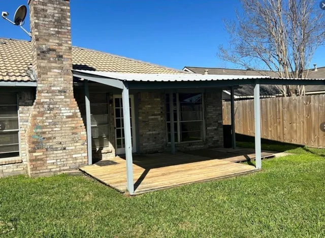a view of backyard with a small cabin