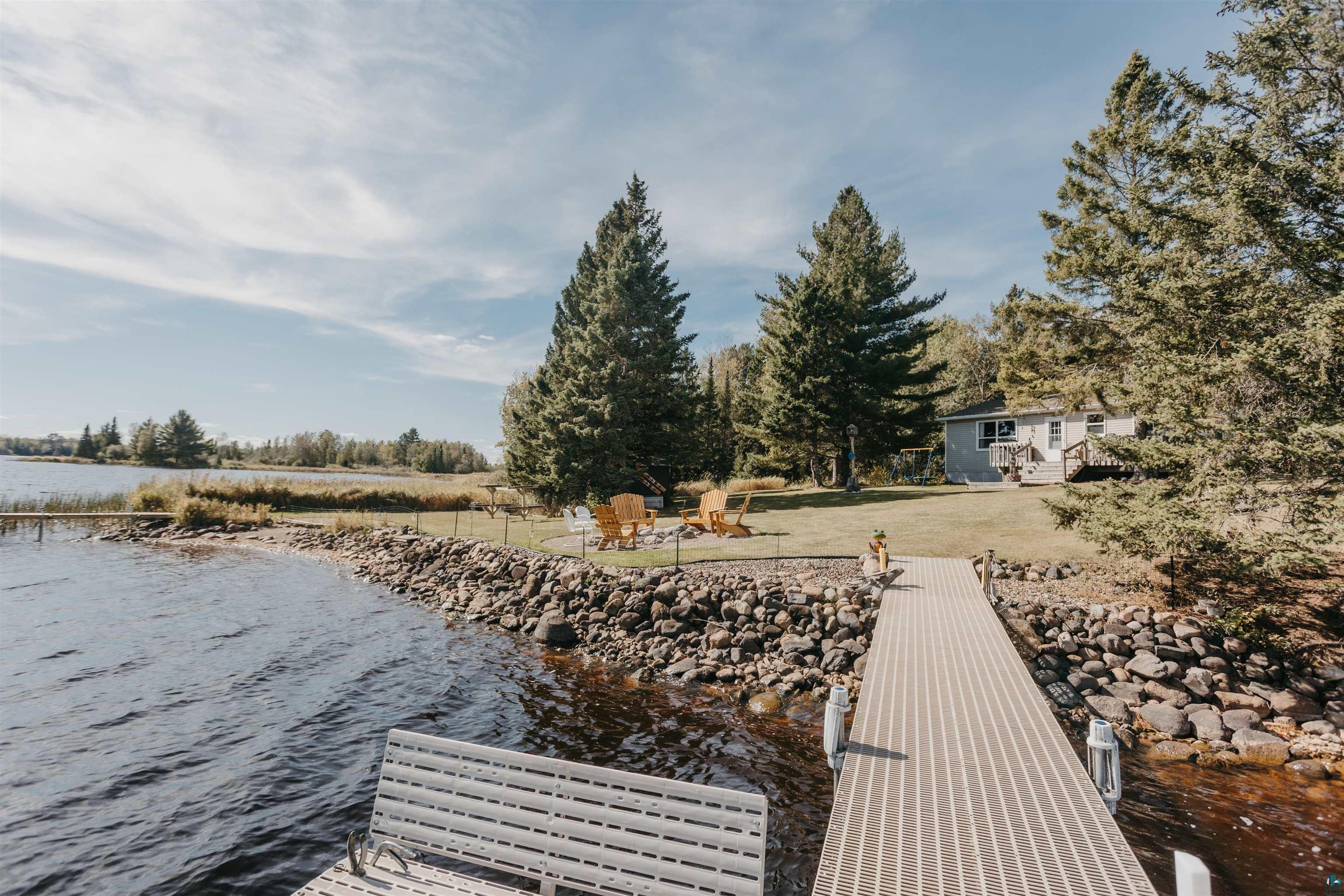 2308 South Weiberg Point Road Makinen, MN 55763 - Photo 23 of 33 View of dock with a water view and an outdoor fire pit