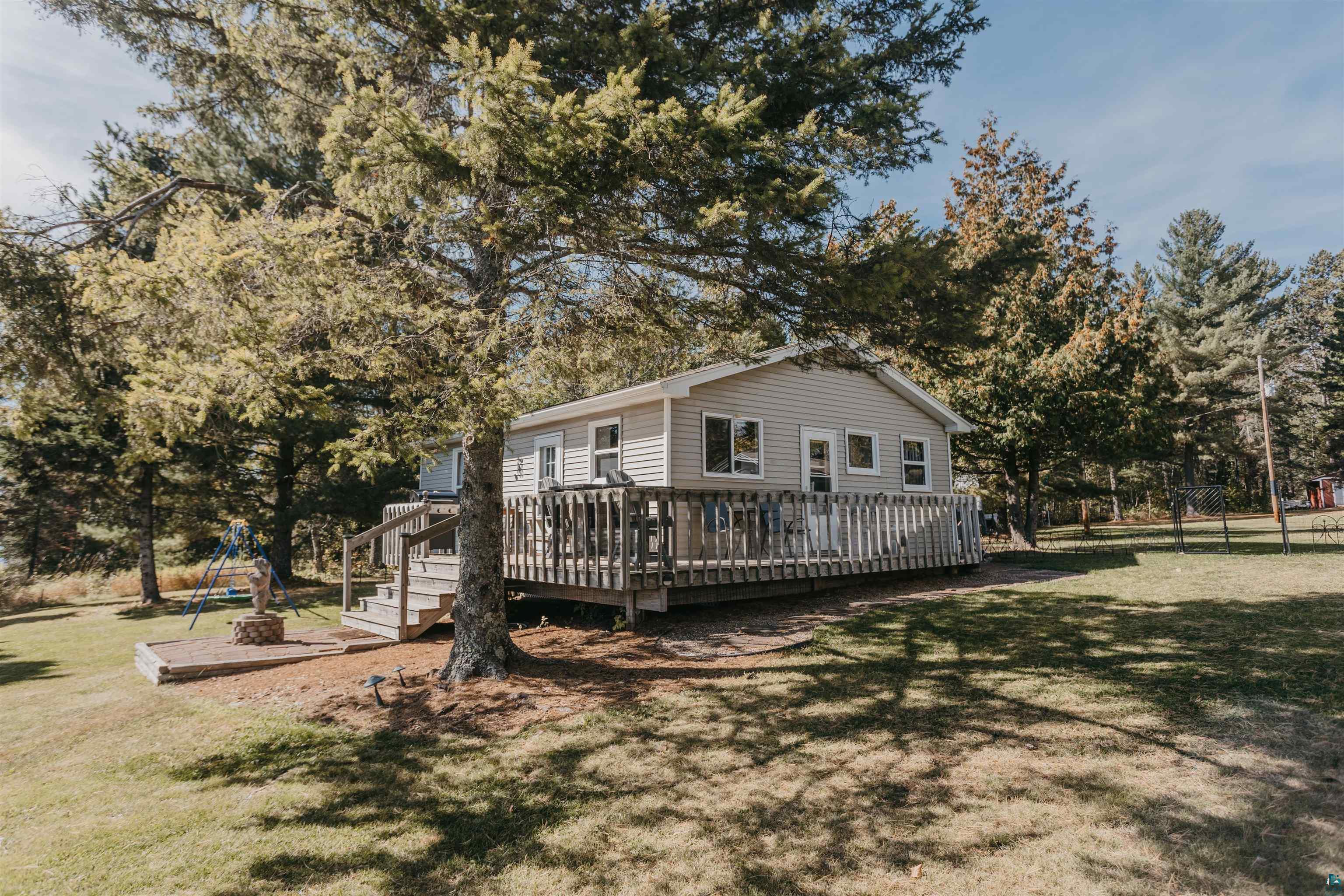 2308 South Weiberg Point Road Makinen, MN 55763 - Photo 3 of 33 Exterior space featuring a wooden deck and a lawn