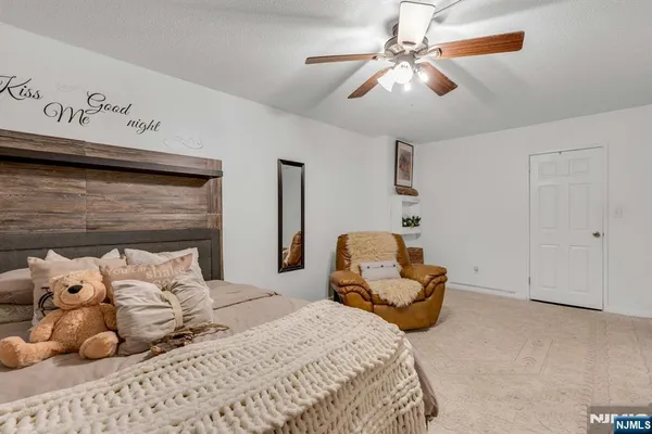 a bathroom with a sink a mirror and a shower