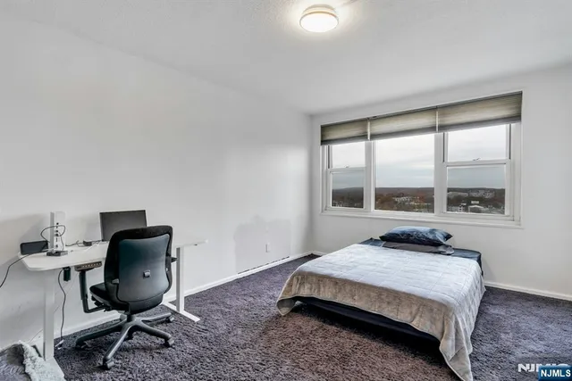 a bathroom with a sink and mirror with toilet