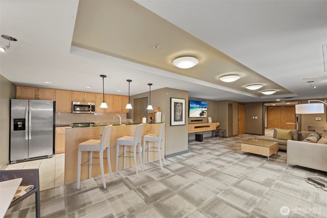 a view of workspace with wooden floor and lounge chair