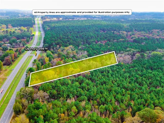 a view of a lush green hillside and a building