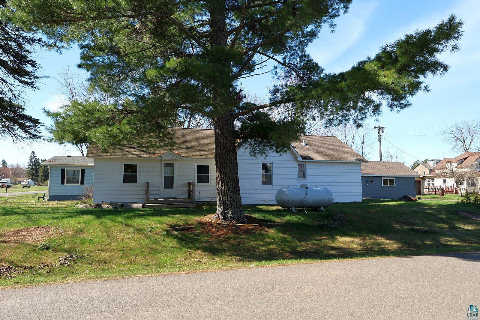 83185 Washington Avenue Port Wing, WI 54865 - Photo 22 of 26 White exterior residence featuring a front porch with wooden railings
