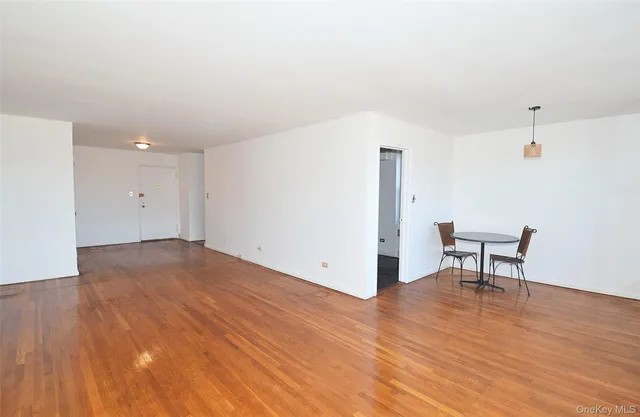 a view of a livingroom with wooden floor