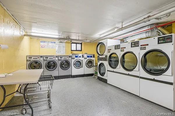 41-42 42nd Street, Unit E4 Queens, NY 11104 - Photo 13 of 17 a utility room with dryer and washer