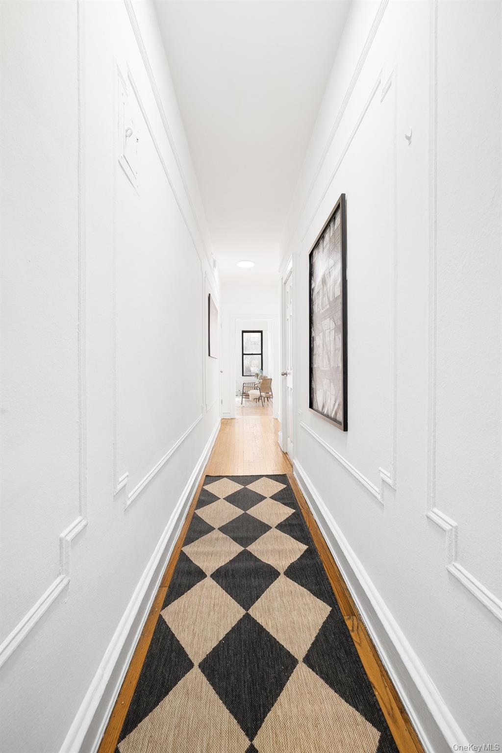 41-42 42nd Street, Unit E4 Queens, NY 11104 - Photo 5 of 17 a view of a hallway with front door