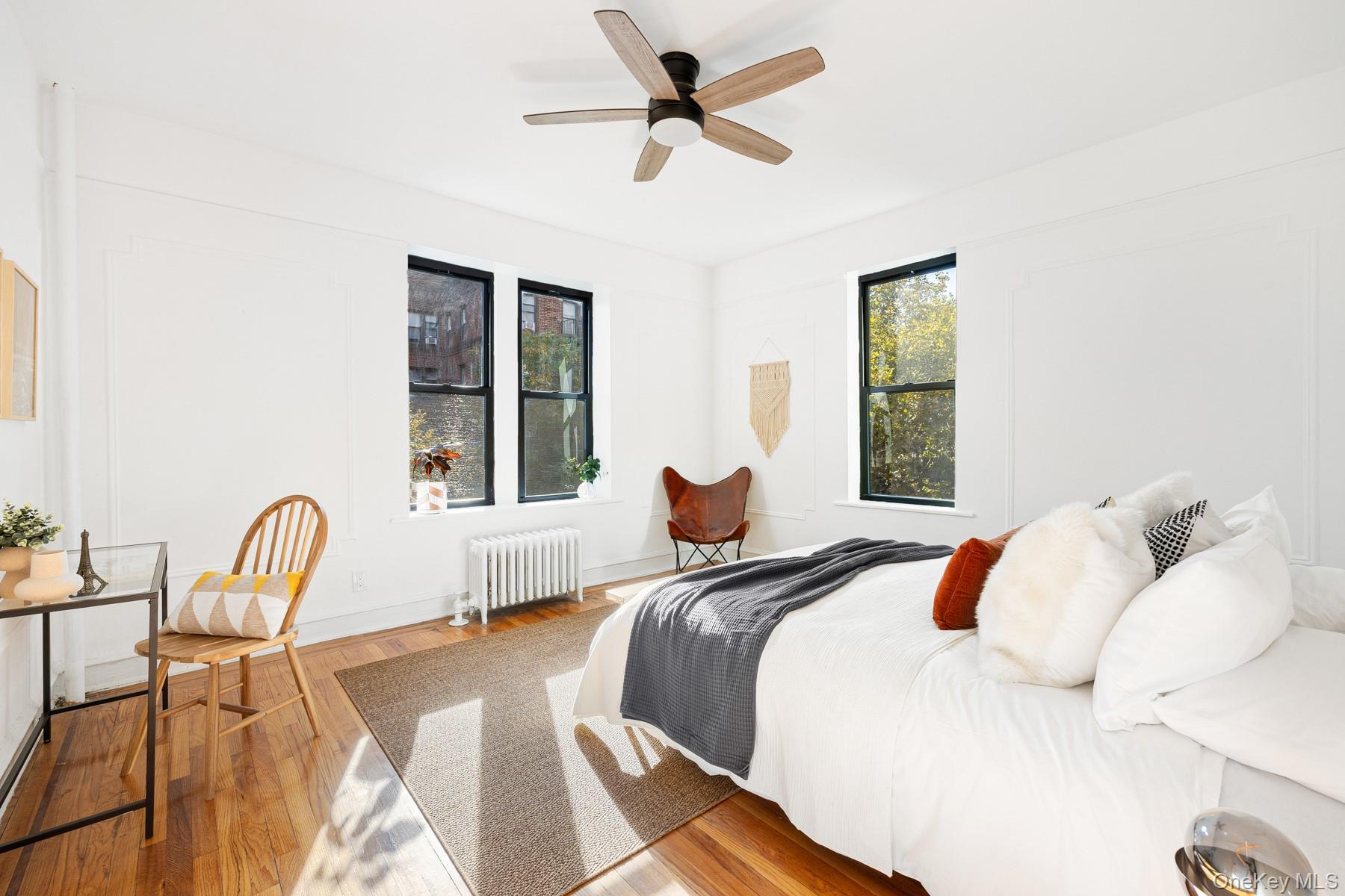 41-42 42nd Street, Unit E4 Queens, NY 11104 - Photo 9 of 17 a bedroom with a bed and a window