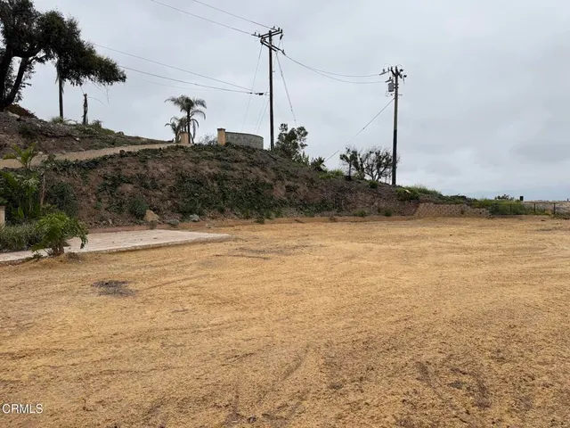 a view of a yard with an ocean view