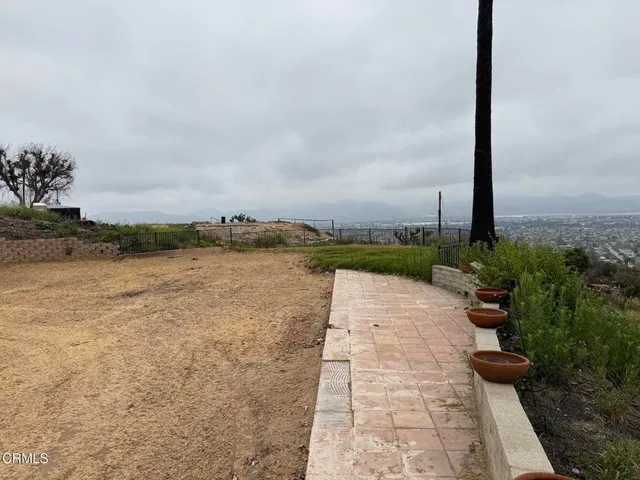 a view of a beach with a mountain in the background