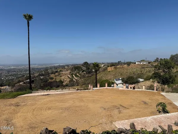a view of a building with a snow in the background