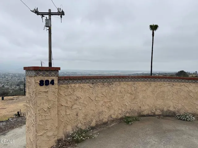 a view of a backyard with sitting area