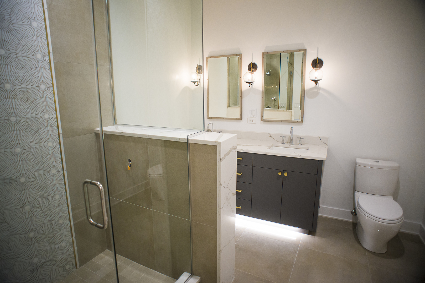 1104 West Madison Street, Unit 2S Chicago, IL 60607 - Photo 5 of 9 a spacious bathroom with a double vanity sink toilet and a mirror
