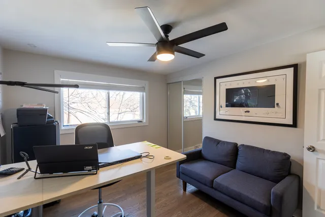 a work room with furniture and windows