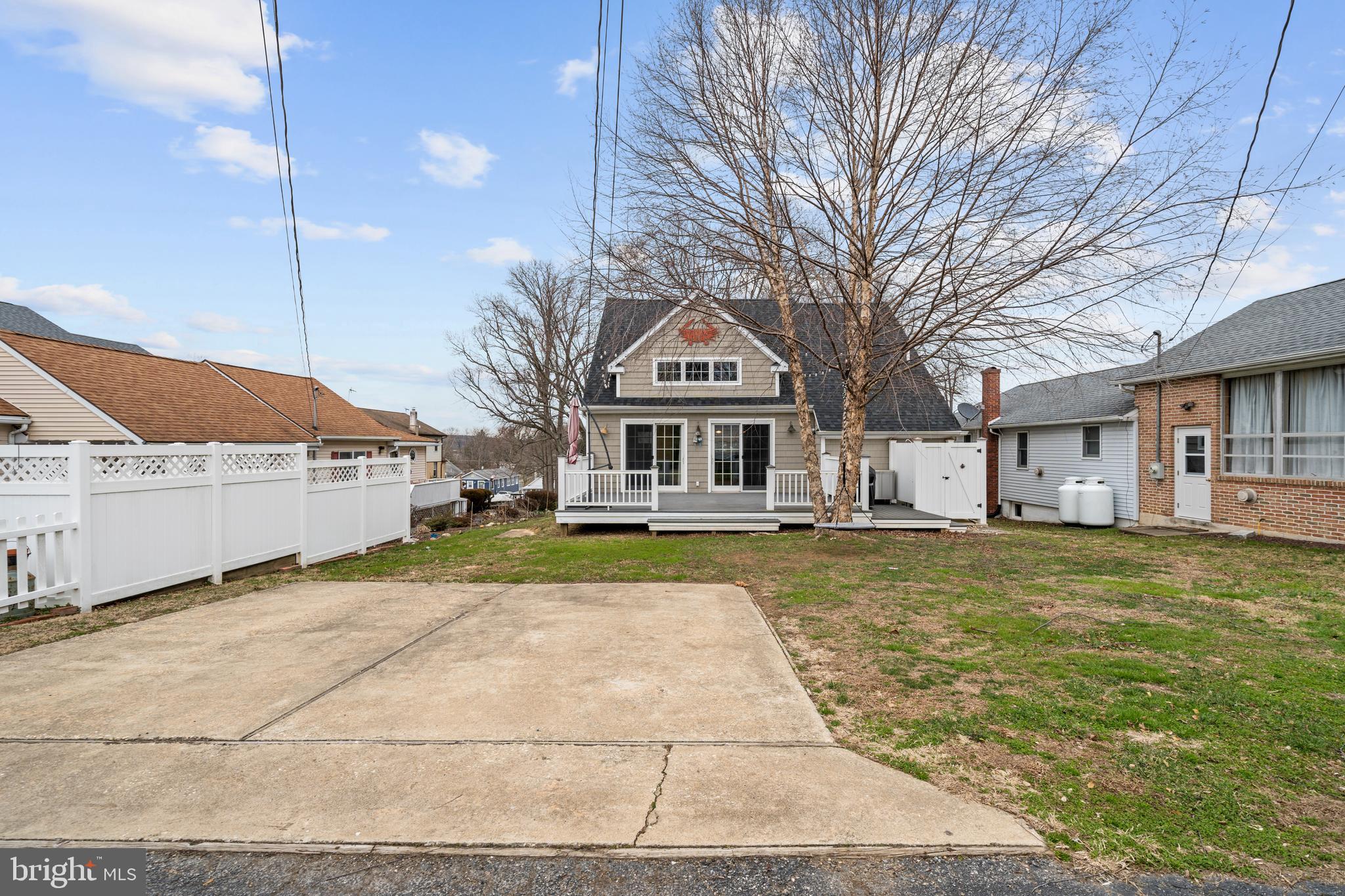 38 Virginia Avenue Earleville, MD 21919 - Photo 12 of 60 a front view of a house with a garden and trees