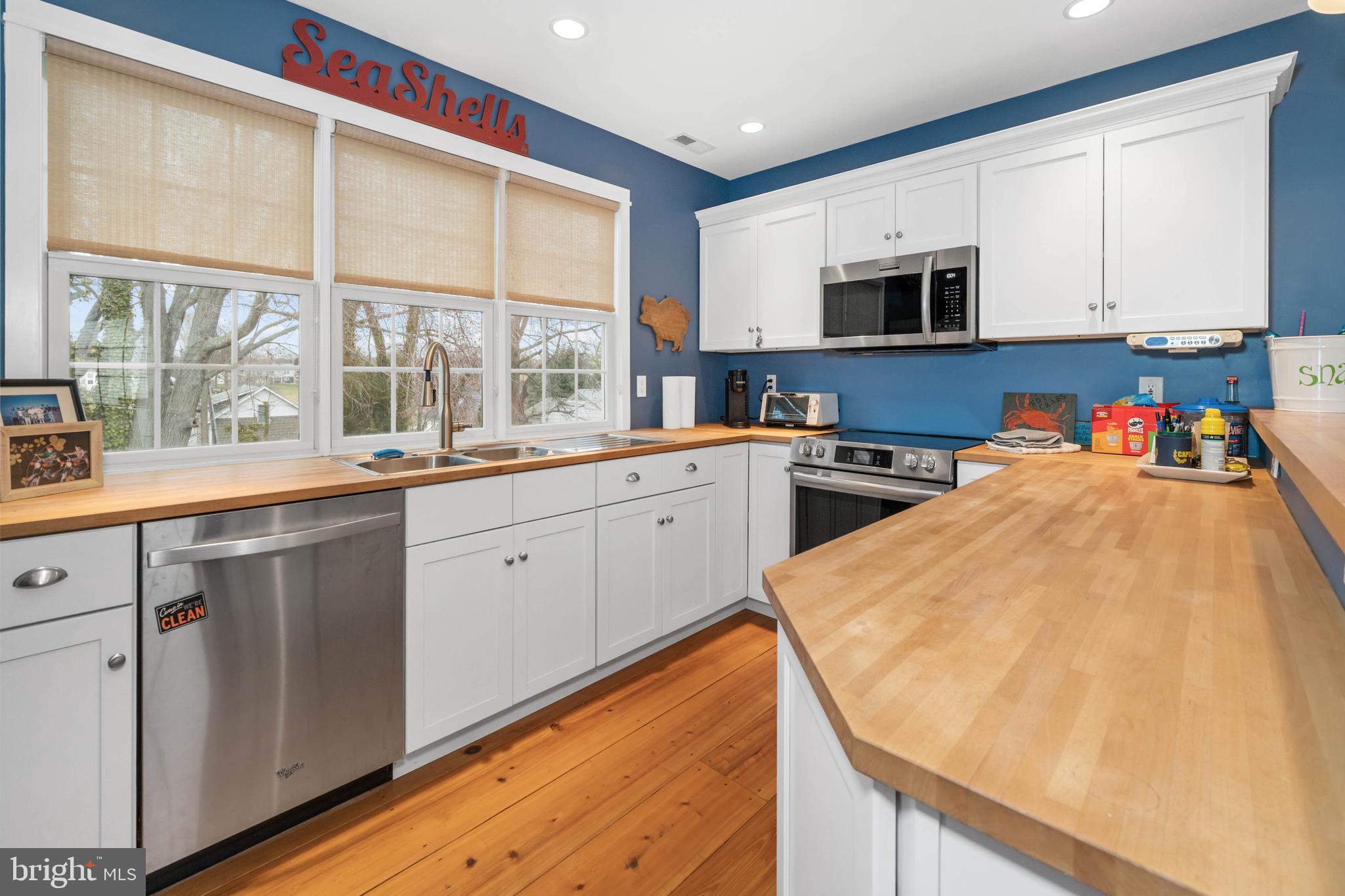 38 Virginia Avenue Earleville, MD 21919 - Photo 29 of 60 a open kitchen with stainless steel appliances granite countertop a sink and cabinets with wooden floor