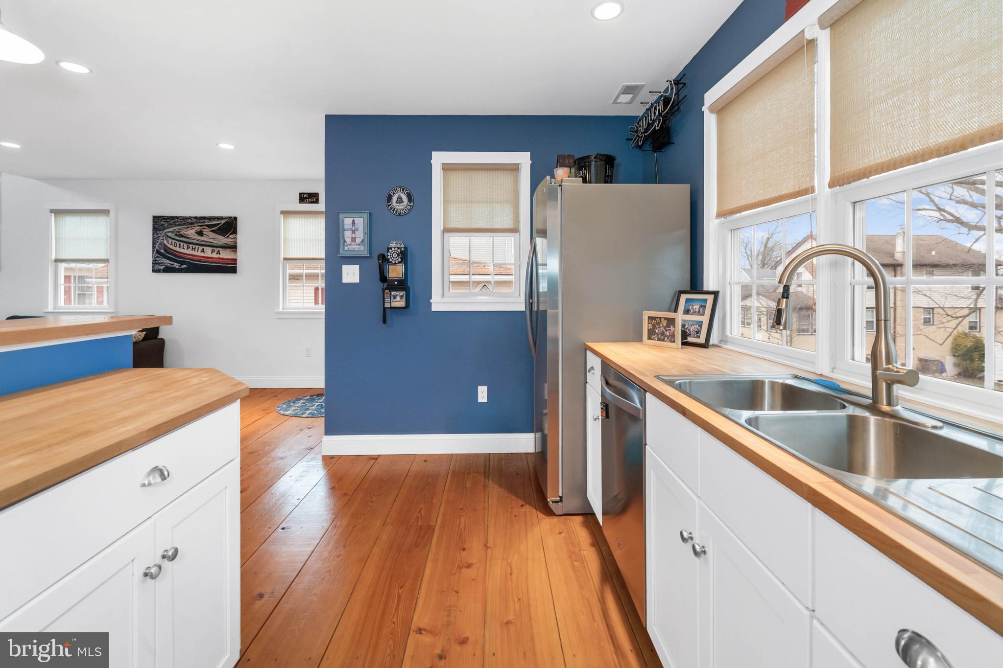 38 Virginia Avenue Earleville, MD 21919 - Photo 33 of 60 a kitchen with kitchen island granite countertop a sink stove and wooden floor