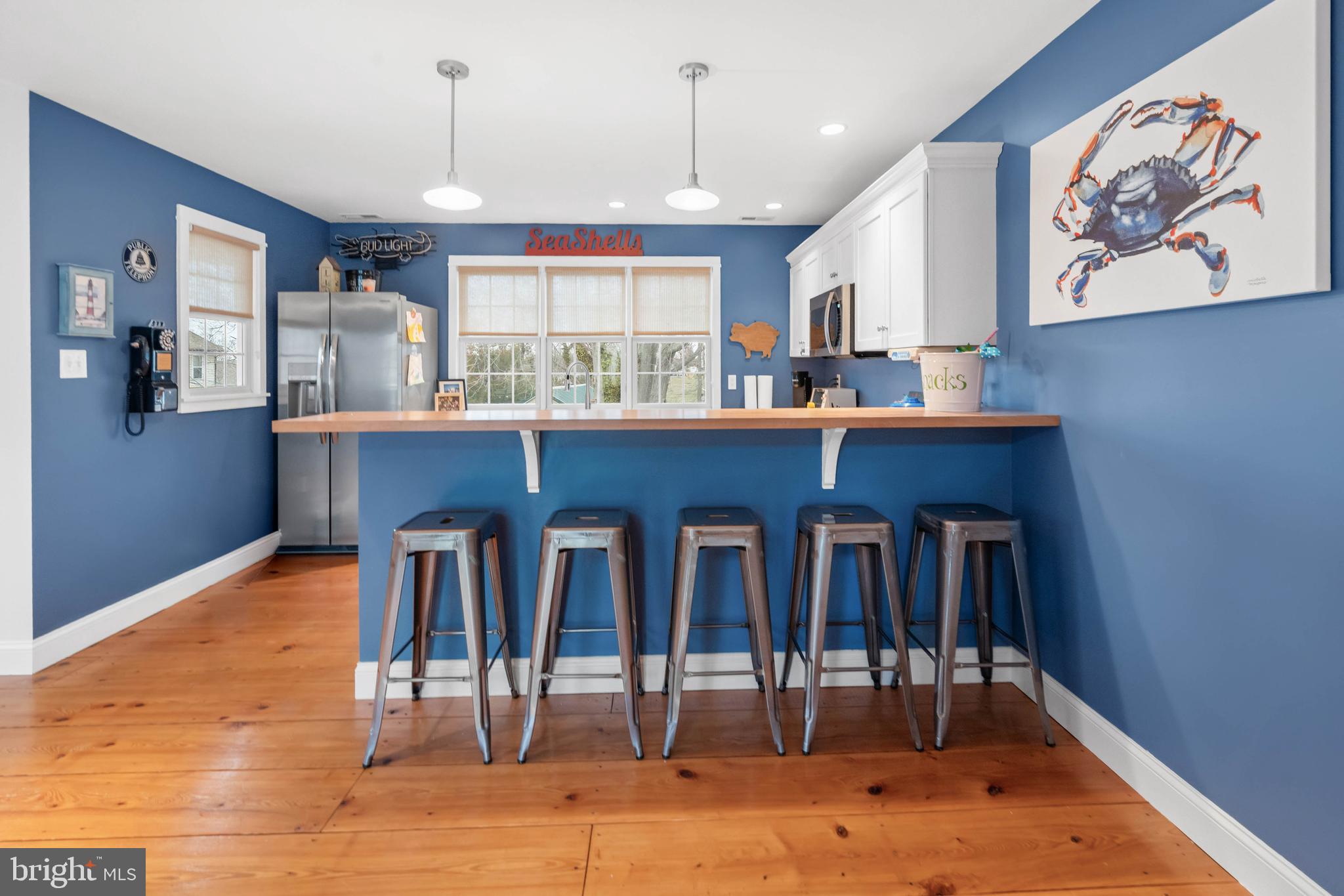 38 Virginia Avenue Earleville, MD 21919 - Photo 36 of 60 a kitchen with stainless steel appliances granite countertop a table chairs sink and cabinets