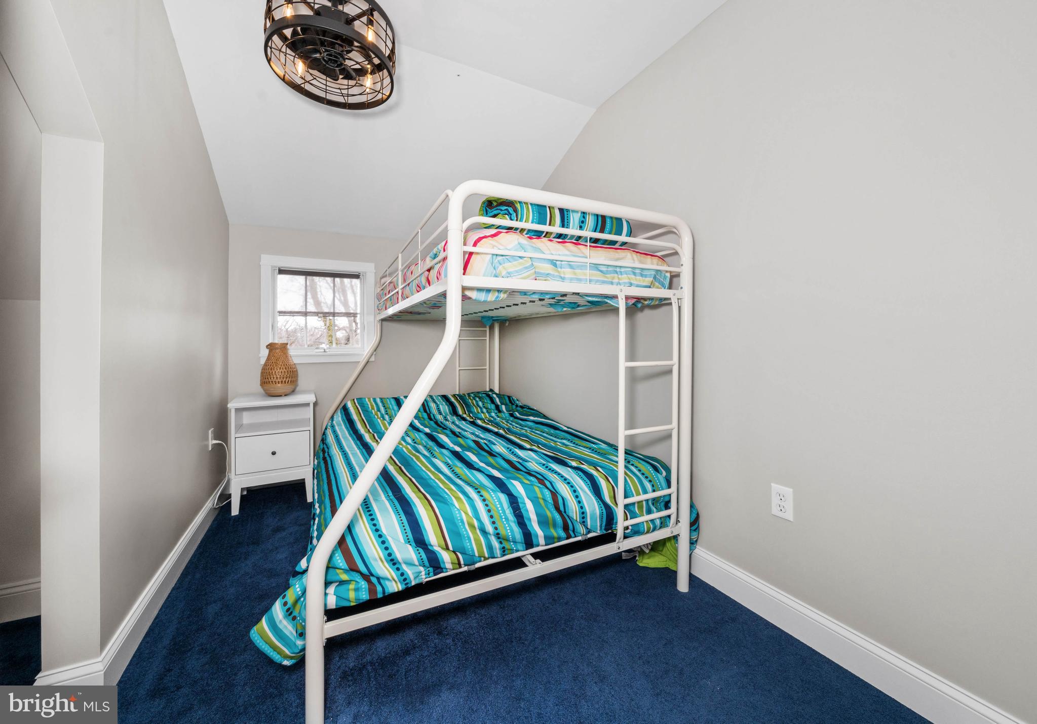 38 Virginia Avenue Earleville, MD 21919 - Photo 51 of 60 a bedroom with a bed and a wall painting