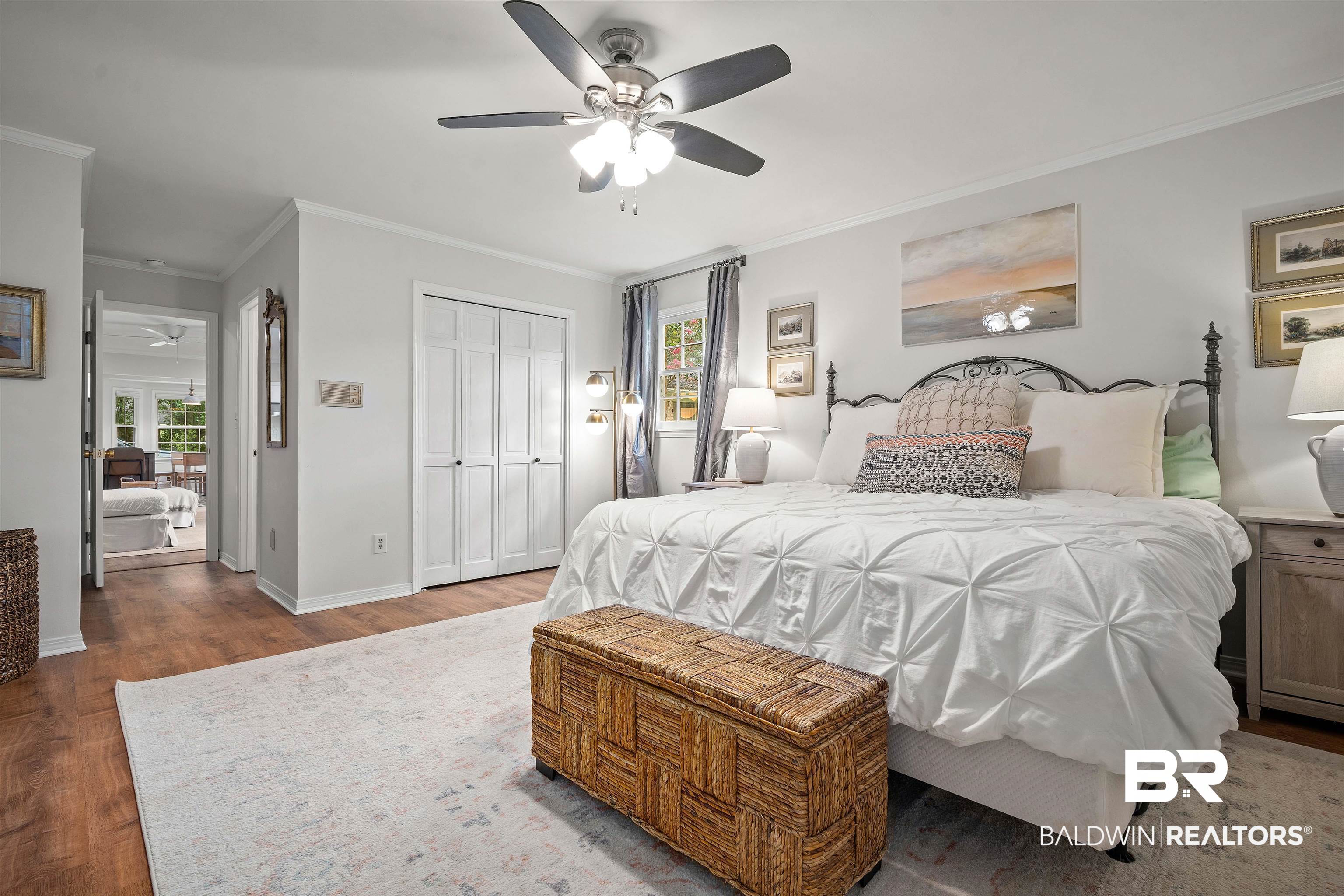 700 Eliza Jordan Road North Mobile, AL 36608 - Photo 20 of 44 Bedroom with crown molding, wood finished floors, ceiling fan, and a closet