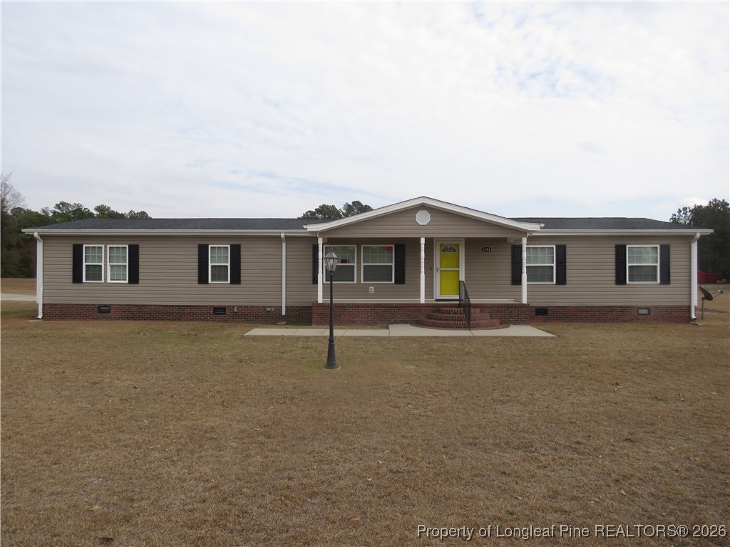 1184 Fisher Road St. Pauls, NC 28384 - Photo 1 of 29 front view of a house with a stove