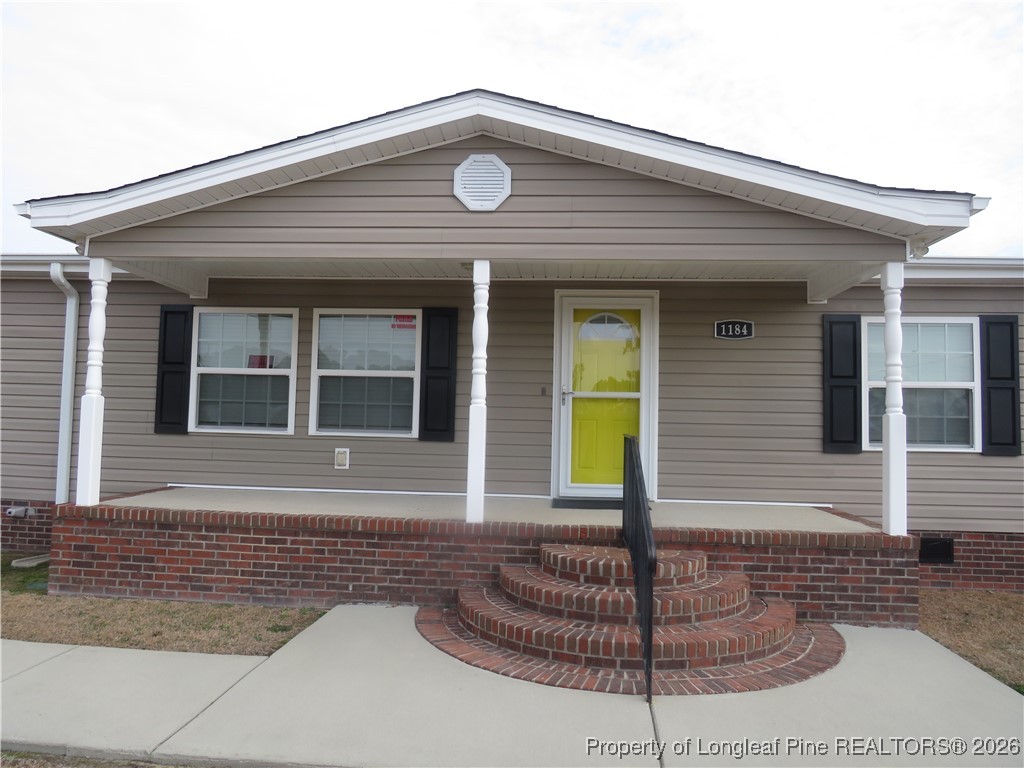1184 Fisher Road St. Pauls, NC 28384 - Photo 2 of 29 a front view of a house