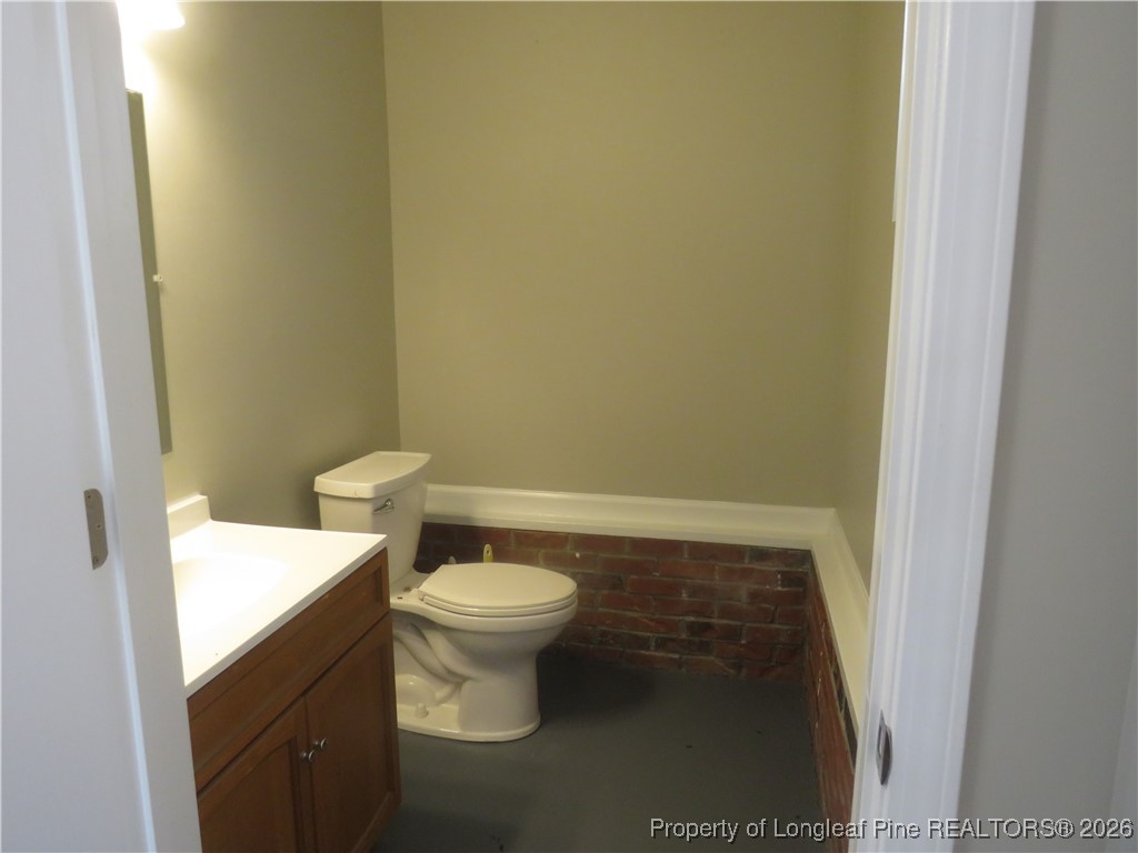 1184 Fisher Road St. Pauls, NC 28384 - Photo 29 of 29 a bathroom with a sink and a toilet