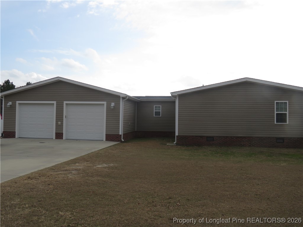 1184 Fisher Road St. Pauls, NC 28384 - Photo 7 of 29 a view of a house with a backyard